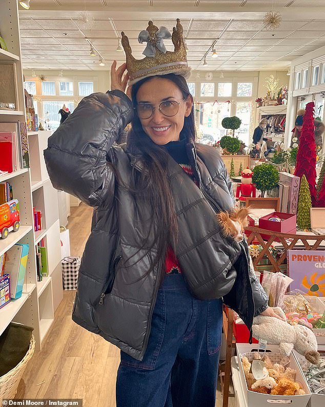 Demi Moore tries on a glittery gold crown as she shares beaming snap throughout ‘royal purchasing spree’